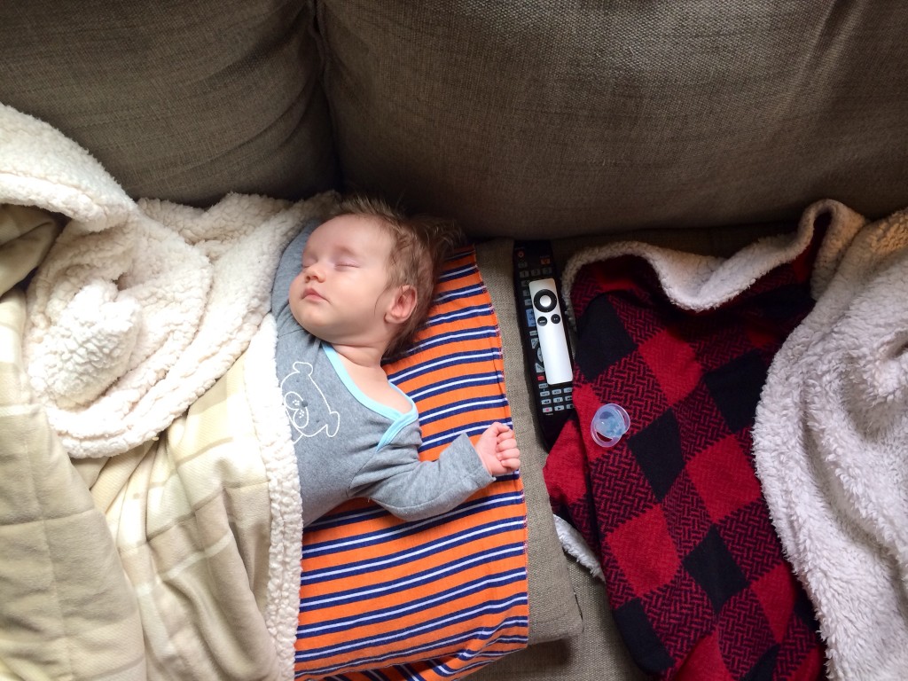 Sleeping baby gets the whole couch. And the remotes. Thankfully, he left it on the U.S. Open quarterfinal. So thoughtful.